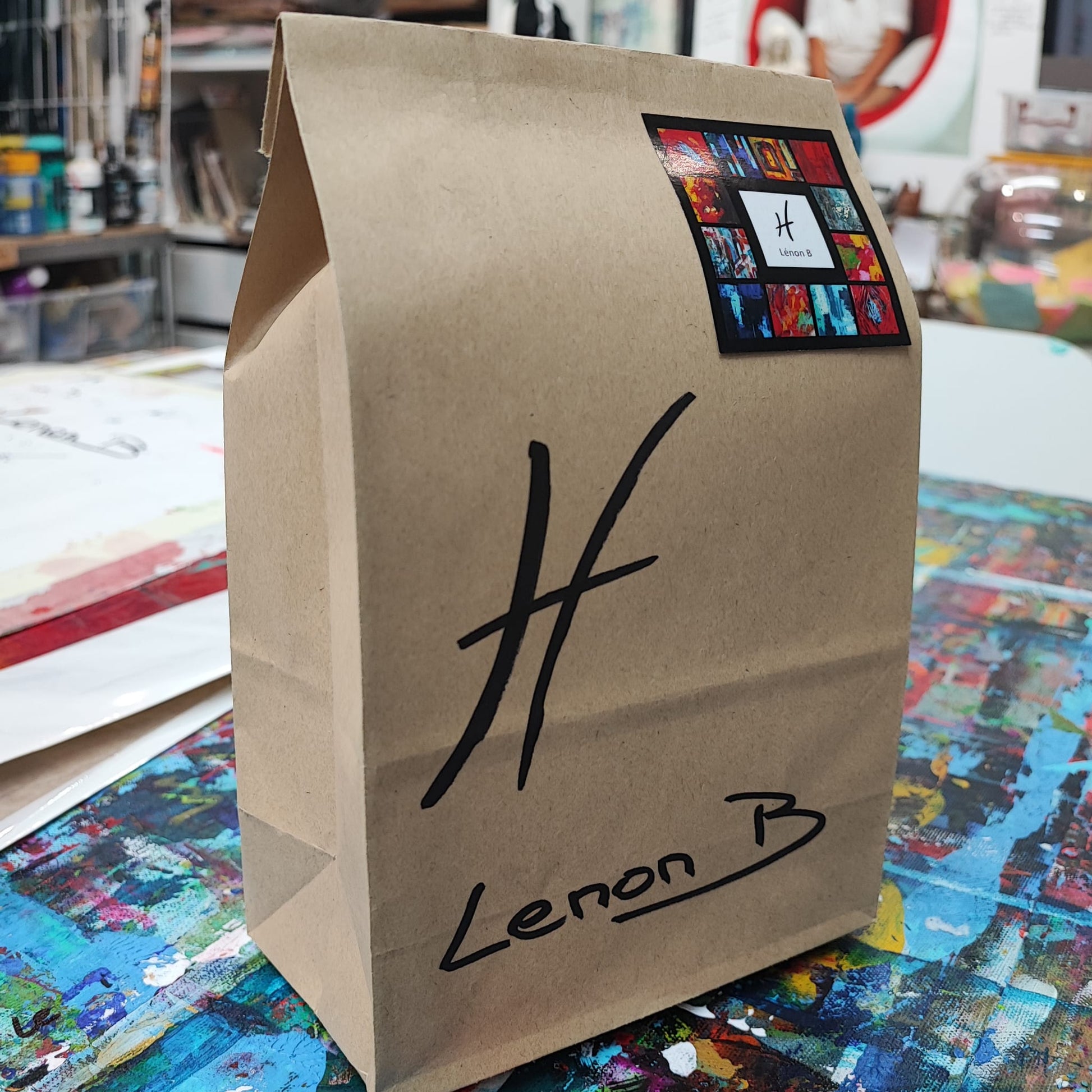 Beautifully wrapped art gift package featuring original artwork by Lenon B, perfect for celebrating special occasions with a unique and thoughtful present.