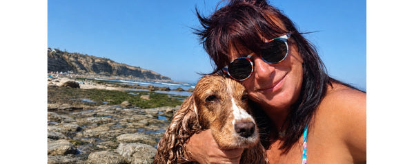 Lenon B at the beach with her cocker spaniel Zoé, end of summer in Ericeira