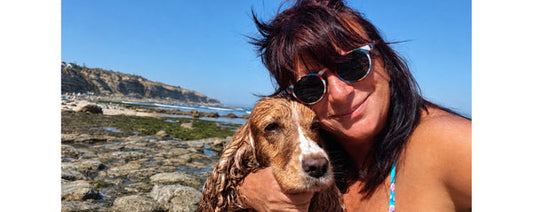 Lenon B at the beach with her cocker spaniel Zoé, end of summer in Ericeira