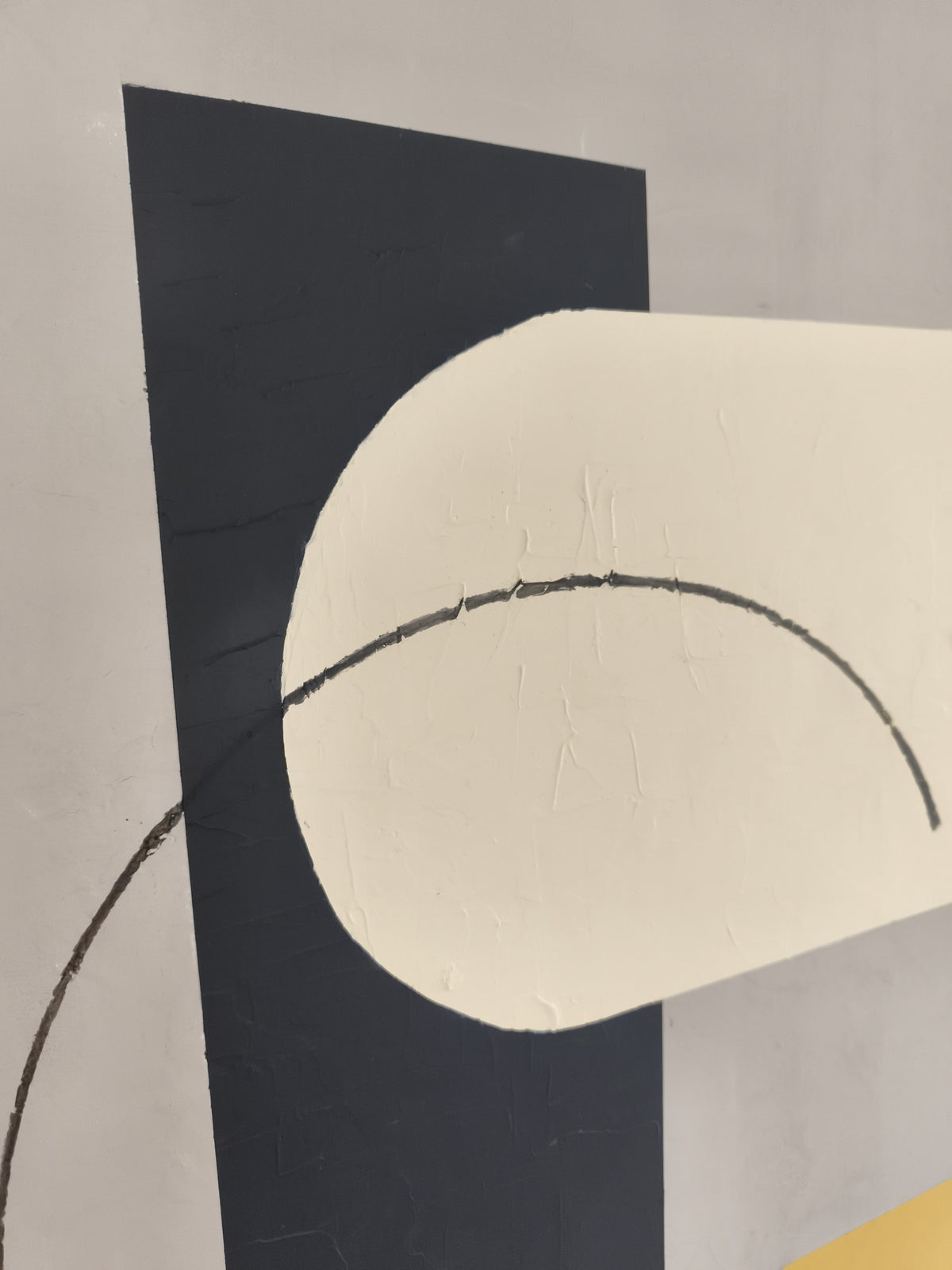 Detail of Between: the black arc over the cream shape