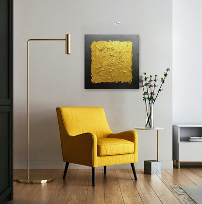 Gold IV by Lenon B hanging above a yellow armchair next to a brass floor lamp