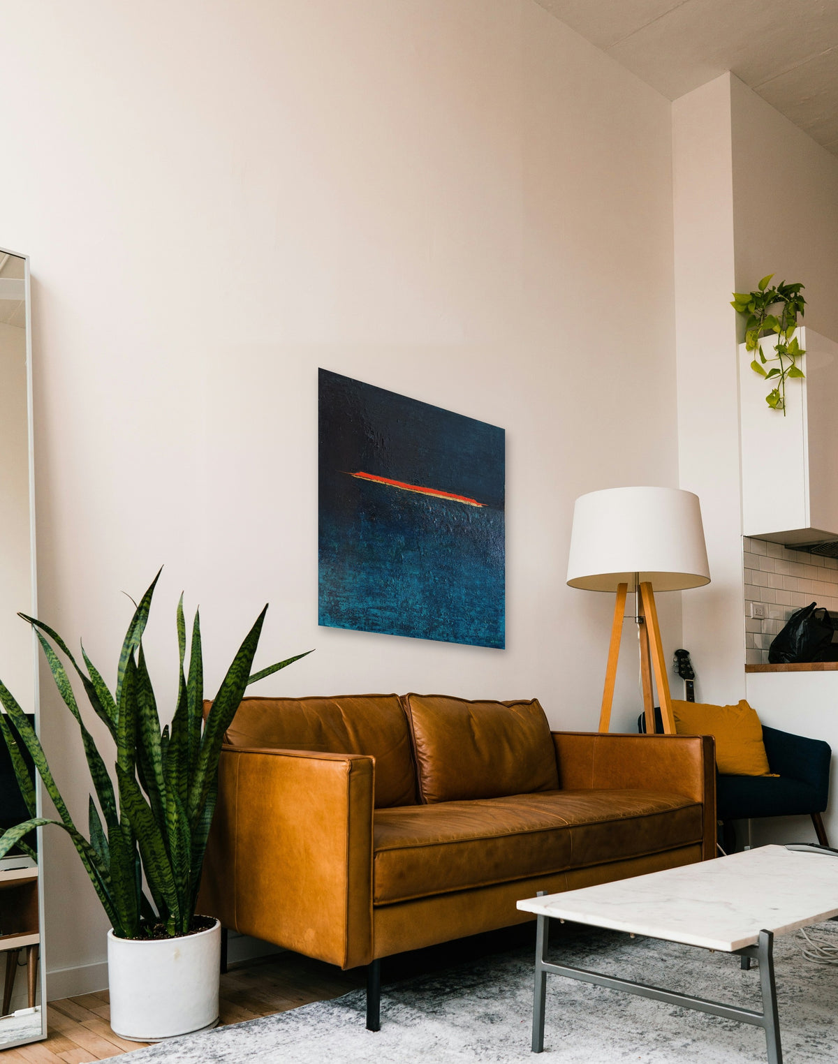 The Line by Lenon B above a leather sofa, true scale